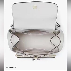 Kate spade backpack. In great condition, only been used once. Cream color